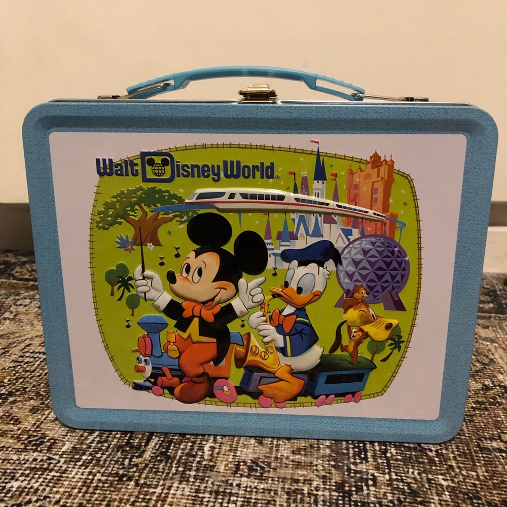 D23 exclusive anniversary lunch box with pins.